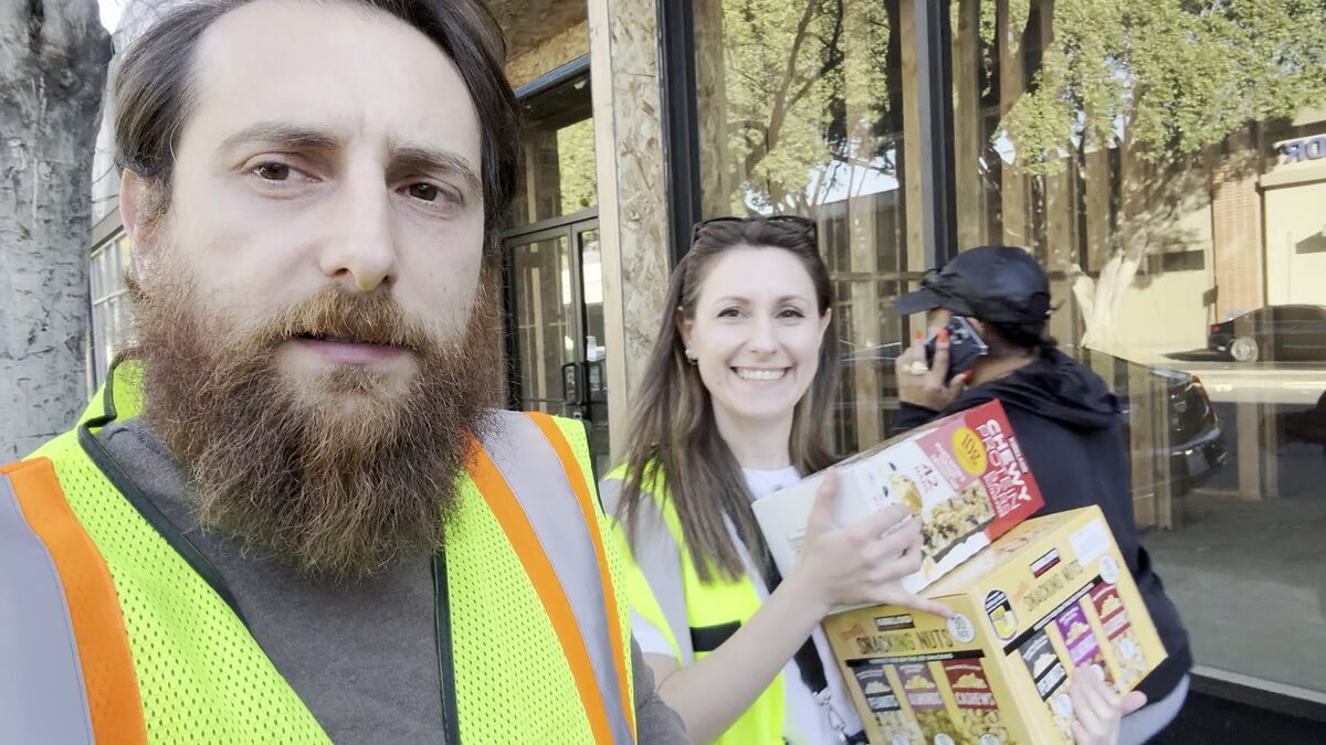 Zhirayr Gumruyan wearing a safety vest and delivering food supplies during the Palisades fire relief effort in Pasadena